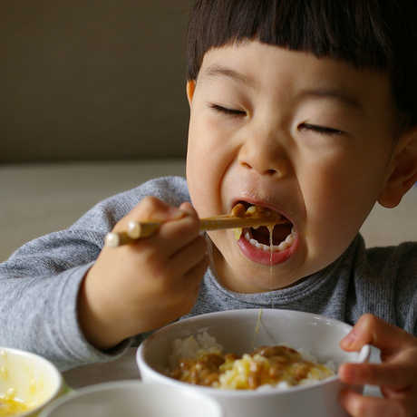 Child Eating with chopsticks
