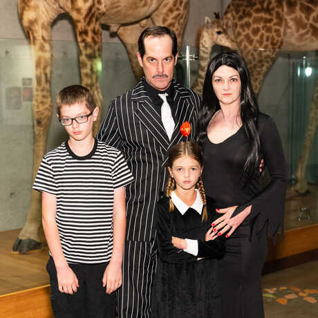 A family dressed up as the Addams Family at SuperNatural Halloween at the Academy