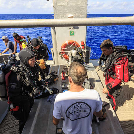 Scientific divers aboard a dive boat in the Marshall Islands