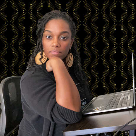 Nicole Jackson sitting at her computer