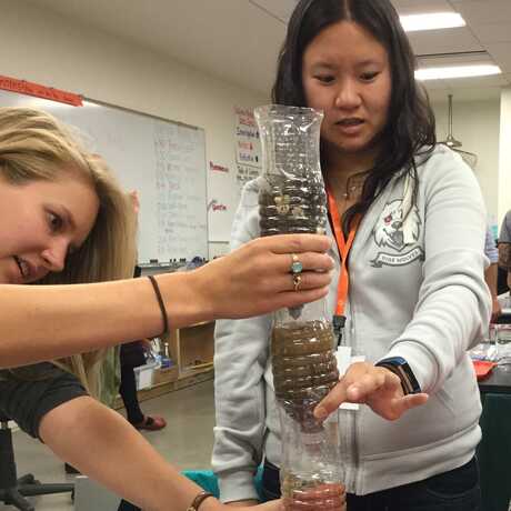 teachers learn while making water filters